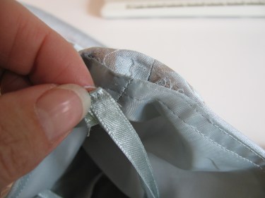 taking out the ribbon hanger on the dress sewing blog 228