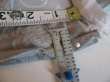 measuring the side seam while taking in the bust of a dress, sewing blog 234