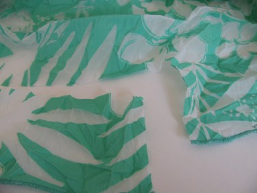 a small cut of fabric to practice serging a hem on, 312