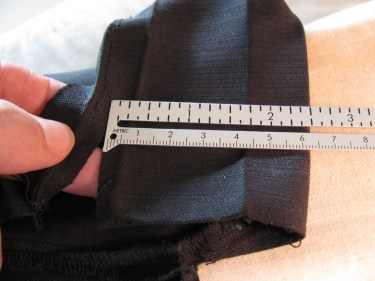 cutting off excess on vent for pants, 543