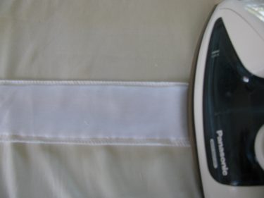 pressing the interfacing onto the facing, blurred, 363