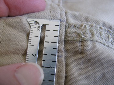 using a seam gauge to measure the amount to be taken in at the skirt waist, 734