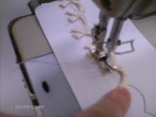 sewing loops down to a piece of paper, 