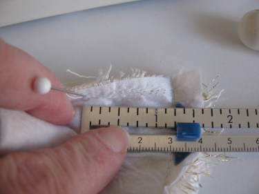 measure the amount you need to take up on the wide shoulder strap