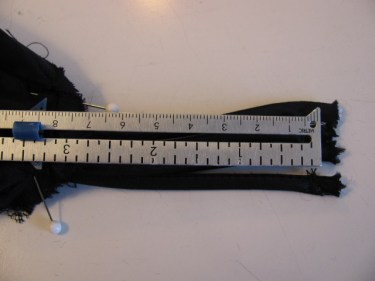measuring how much I need to cut off to shorten spaghetti straps