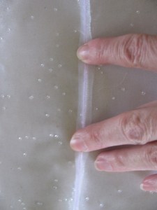 finger pressing sheer fabric down for french seam, 984