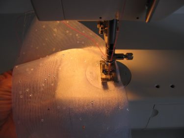 sewing a scrap fabric into a french seam sample, 986