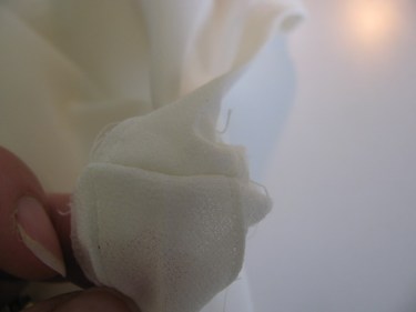 making sure the binding seam looks perfect on blouse, 996