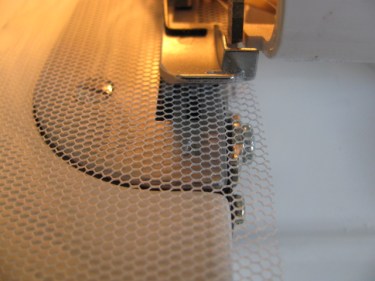 cutting the tulle with the blade of a serger, 1056