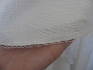 the edge of tulle on a dress, 1062