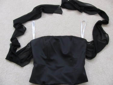 Photo of the top half of Michelle's black bridesmaid dress with the chiffon ties floating above. How to put gussets in a dress or top