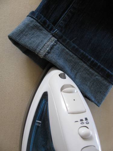 ironing the new hemline on Michelle's jeans