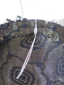 Tailor tack on inside of shoulder sleeve at the crown of the sleeve