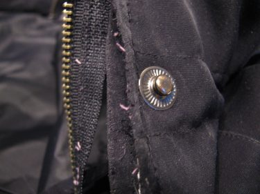 close up of snap on jacket, 1409