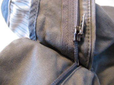 rip out stitches next to tab of jean zipper