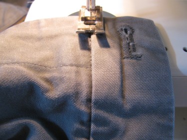 stitch in the ditch on outside of waist on jean zipper, 7140