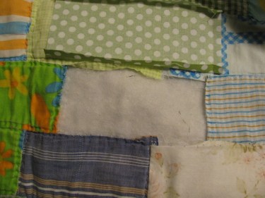 The new piece of fabric is lying upside down, right sides together with the piece I am sewing it to