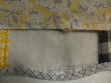 Stitch the one side of the rectangle to the rectangle above it on the quilt