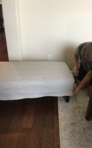 how to reupholster a bench, me pulling the fabric taut, 3523