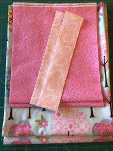 4247, all the cut fabrics in a pile, pillowcase with french seams