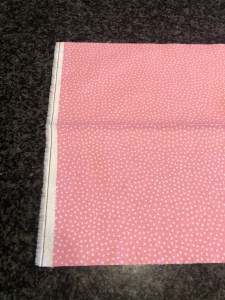 4255, unfold the cuff fabric and place it right side up on the work surface.