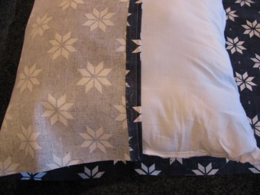 9158, stitch one side of the pillow edge by folding under 1/2" and stitching it across